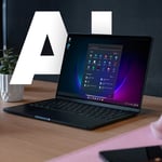 Laptop med texten AI bakom